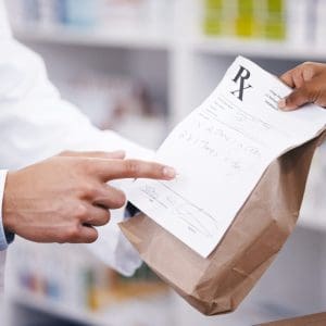 Bag, medicine or pharmacist hands a person healthcare prescription, pointing or pharmacy receipt. Zoom, shopping or doctor giving customer products, instruction or package for medical retail services.